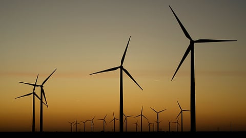 Wind turbines stretch across the horizon at dusk at the Spearville Wind Farm, Sept. 29, 2024, near Spearville, Kan.