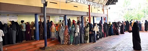 A long queue of women voters waiting to cast their votes in the local body election, at Beema Pally in Thiruvananthapuram on December 9, 2025.