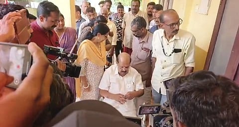 Former minister and senior CPM leader G Sudhakaran waiting in front of the polling station at Paravoor Government Higher Secondary School in Alappuzha to cast his vote.