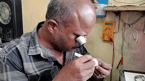 Martin K T of Lonan Watch House in Thevara Junction busy at work