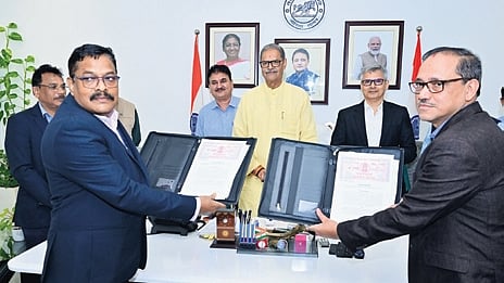 Officials from both sides signing agreement in presence of dy CM and Energy minister KV Singh Deo.