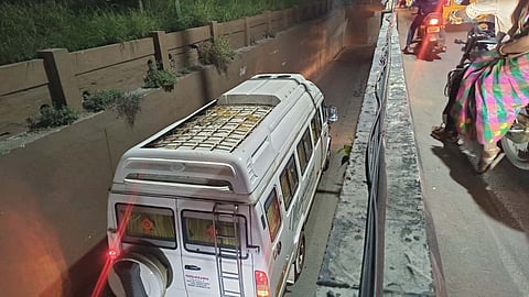 A tourist vehicle from Kerala got stuck in the Avinashi road flyover underpass on Sunday night.
