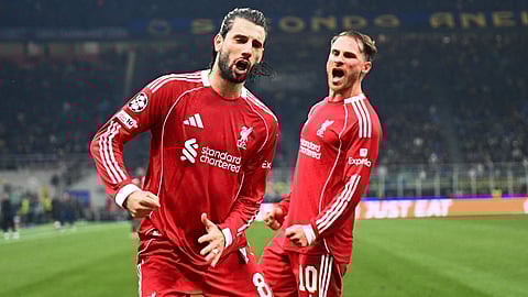 Liverpool's Dominik Szoboszlai celebrates scoring a penalty kick with Liverpool's Alexis Mac Allister during the UEFA Champions League phase day 6 football match between Inter Milan and Liverpool at San Siro stadium in Milan, on December 9, 2025.