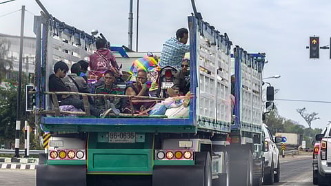 Thai residents who fled homes following the clashes between Thai and Cambodian soldiers, head to a shelter in Surin province, Thailand, Wednesday, Dec. 10, 2025.