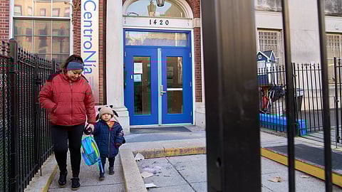 Families leave CentroNia at the end of the school day in Washington, Tuesday, Dec. 9, 2025.