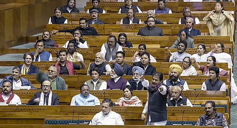 Leader of Opposition in the Lok Sabha Rahul Gandhi with party MP K.C. Venugopal during a discussion on election reforms in the House in the Winter session of Parliament, in New Delhi, Tuesday, Dec. 9, 2025.