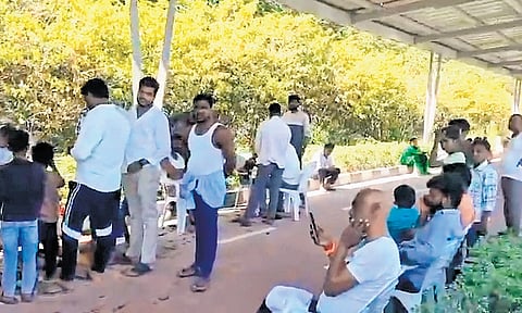 Men and children get tonsured as part of last rites on the ORR cycling track