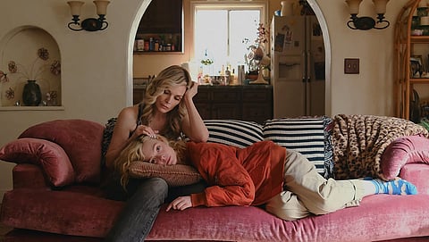 Michelle Pfeiffer (L) and Elle Fanning (R) in a still from Margo's Got Money Troubles