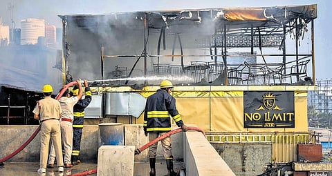 Fire personnel dousing the fire that gutted No Limit Air restaurant-cum-hookah bar at Satya Vihar in Bhubaneswar on Friday morning