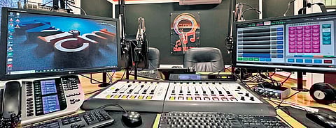 The 101.3 FM studio in Toronto, Canada; (R) Vijay and Mridula at their studio