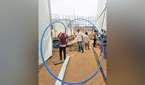 A team of workers lays more than 2 km of underground fibre-optic cable at Bharat Future City on Saturday