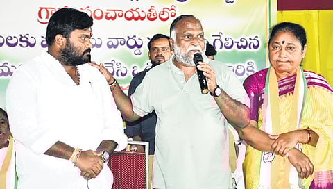 TPCC working president T Jayaprakash Reddy addresses party workers on Sunday while his wife and TGIIC chairperson Nirmala looks on.