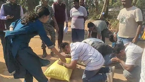 Farmers laying paddy bags before Bargarh collector on Saturday at Padampur over procurement problems