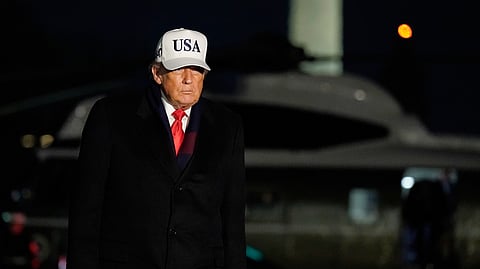 US President Donald Trump talks to reporters as he arrives on the South Lawn of the White House, Saturday, Dec. 13, 2025.