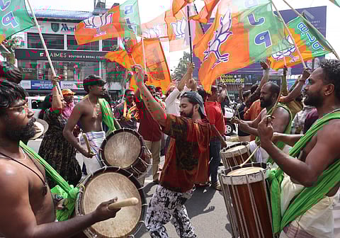 Jubilant NDA workers celebrate their victory.