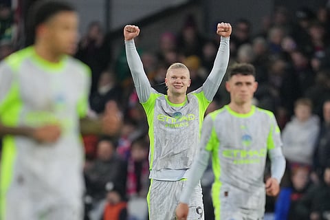 Manchester City's Erling Haaland celebrates after scoring his side's third goal during the EPL soccer match between Crystal Palace and Manchester City in London, Sunday, Dec.14, 2025.