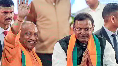 Uttar Pradesh Chief Minister Yogi Adityanath, front left, and Union Minister of State for Finance Pankaj Chaudhary during the latters election as state BJP President, in Lucknow, Sunday, Dec. 14, 2025