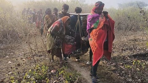 Sukri Kumari was carried by her family members for over a kilometre from her home in Jhalakapat to Karasilli village