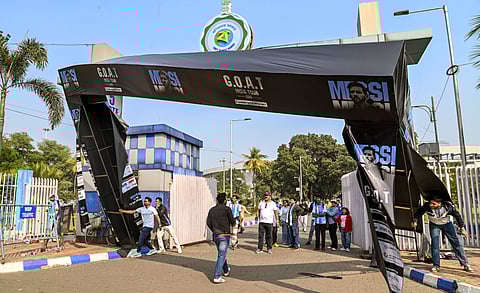 People vandalise an arch gate banner during an event of Argentine footballer Lionel Messi as part of his 'G.O.A.T. India Tour 2025', at Vivekananda Yuba Bharati Krirangan (VYBK), in Kolkata, Saturday, Dec. 13, 2025.