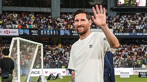 Argentine footballer Lionel Messi greets the gathering during the 'GOAT India Tour 2025', at Wankhede Stadium, in Mumbai, Sunday, Dec. 14, 2025.