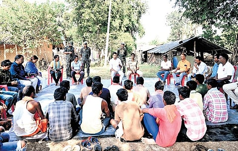 The collector and SP holding discussion with villagers at Mariwada