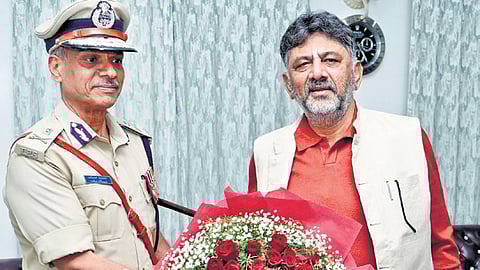 DCM DK Shivakumar greets Director General of Police (Prisons and Correctional services) Alok Kumar at the former’s residence in Bengaluru on Monday.