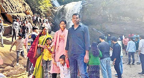 Tourists pose at Rani Duduma in Nandapur block of Koraput district.