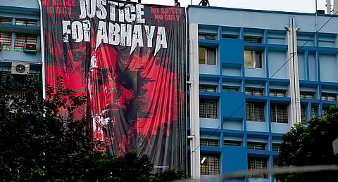 A banner hung by junior doctors at the RG Kar Medical College and Hospital in protest against the alleged sexual assault and murder of a postgraduate trainee doctor at the hospital, in Kolkata, Monday, Aug. 19, 2024.