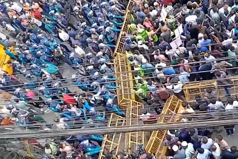 The protest followed threats against Indian diplomats, prompting India to summon Bangladesh's envoy. The MEA said it expects the interim government to ensure the safety of Missions and Posts in Bangladesh in keeping with its diplomatic obligations.