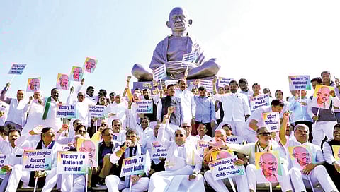 Congress legislators, including Chief Minister Siddaramaiah, Deputy Chief Minister DK Shivakumar and ministers, stage a protest near Mahatma Gandhi statue at Suvarna Vidhana Soudha in Belagavi on Wednesday