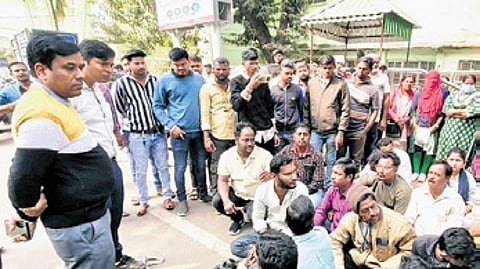 The outsourced attendants at AHPGIC staging dharna on Wednesday.