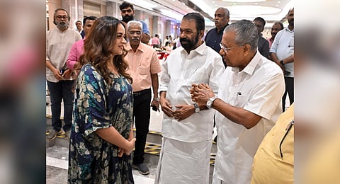 Actress Bhavana, Chief Minister Pinarayi Vijayan, and Education Minister V Sivankutty engage in friendly conversation at the Christmas-New Year celebration hosted by the Chief Minister in Thiruvananthapuram.