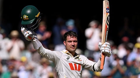 Australian batsman Alex Carey celebrates scoring a century on the first day of the third Ashes cricket Test match between Australia and England at the Adelaide Oval in Adelaide on December 17, 2025.