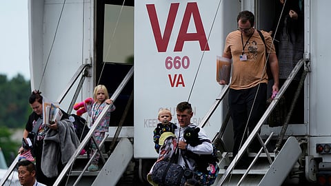 Refugees from South Africa arrive Monday, May 12, 2025, at Dulles International Airport in Dulles, Va.