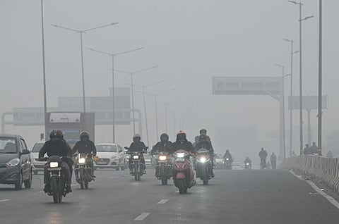 Image of Vehicles plying Delhi road.