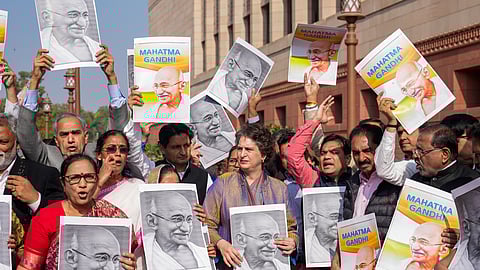 Congress MP Priyanka Gandhi Vadra and other opposition MPs participate in a protest march against the VB-G RAM G Bill, introduced by the union government to replace the Mahatma Gandhi National Rural Employment Guarantee Act (MGNREGA), 2005, during the Winter session of Parliament, in New Delhi, Tuesday, Dec. 16, 2025.