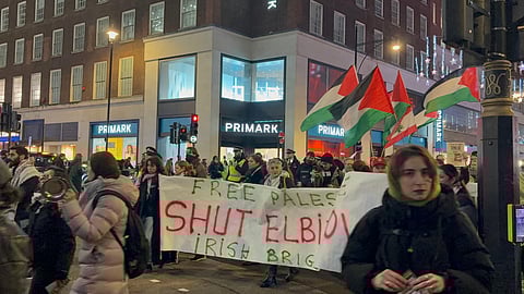 Palestinian supporters protest as they march down Oxford Street, in London, after the Metropolitan Police imposed conditions on a demonstration planned for Portland Place, Tuesday, Dec. 16, 2025.