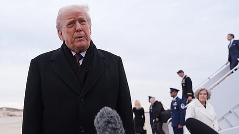 President Donald Trump talks to reporters after arriving on Air Force One, Wednesday, Dec. 17, 2025, at Joint Base Andrews, Md., after attending a casualty return at Dover Air Foce Base.