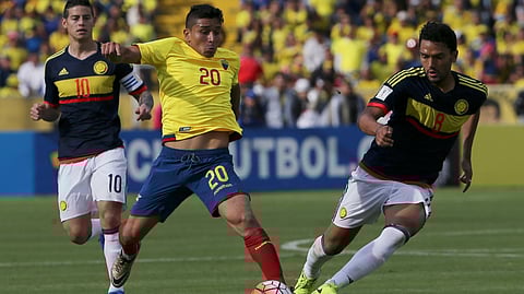 Ecuador's Mario Pineida, center, and Colombia's Abel Aguilar battle for the ball during their 2018 World Cup qualifying soccer match at the Atahualpa Olympic Stadium in Quito, Ecuador, March 28, 2017.