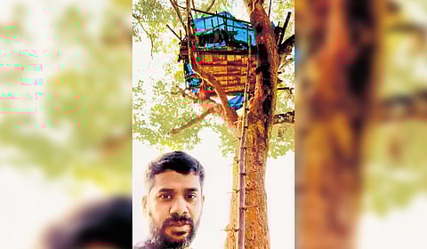 Sunil Titto, a techie from Pune in front of the tree house