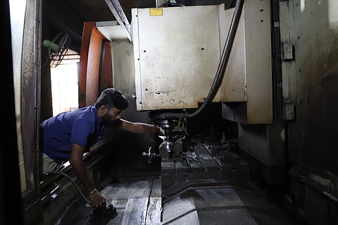 A CNC machine operator in foundry unit at Sundarapuram SIDCO in Coimbatore on Thursday.