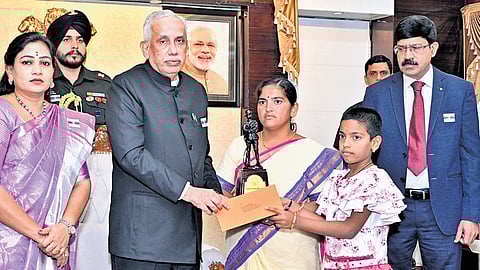Governor S Abdul Nazeer and Home Minister Vangalapudi Anitha take part in the Armed Forces Flag Day celebrations at Lok Bhavan on Friday.