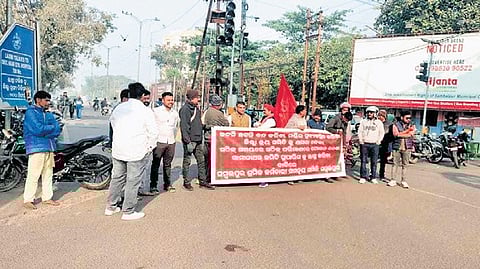Agitators blocking a road during the bandh in Sambalpur on Friday