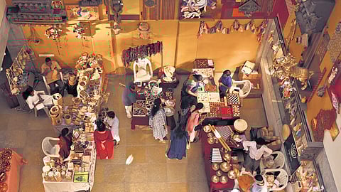 Visitors take a look at the handmade items displayed at the ‘Exclusive Natural Dye Handmade Festival’ organised by the India Handmade Collective (IHMC) in Hyderabad on Saturday;