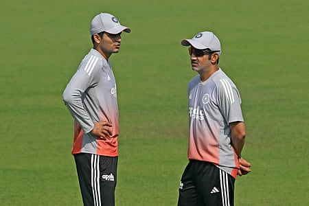Shubman Gill (L) and head coach Gautam Gambhir interact during a practice session