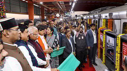 Union Minister for Housing and Urban Affairs Manohar Lal and Madhya Pradesh Chief Minister Mohan Yadav flag off a train during the inauguration of Bhopal metro rail service, at Subhash Nagar station, in Bhopal.
