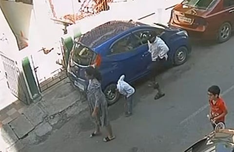 A screen shot of a person seen kicking a boy while he was playing with others on the road at Thyagaraj Nagar in Bengaluru.