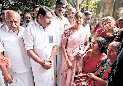 TN BJP president Nainar Nagenthran with the family members of the deceased man in Madurai | K K SUNDAR