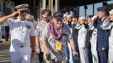 Pearl Harbor survivor Ira Schab, right, is saluted by various members of the armed forces as he leaves the 75th Anniversary National Pearl Harbor Remembrance Day Commemoration on Kilo Pier at Joint Base Pearl Harbor-Hickam, Wednesday, Dec. 7, 2016, in Honolulu.