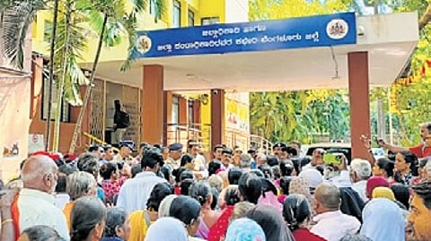 Pensioners protest at the Bengaluru Urban Deputy Commissioner’s office on Tuesday.